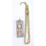 DNG; an Elizabeth II hallmarked silver ingot pendant to commemorate the Queen's Silver Jubilee,