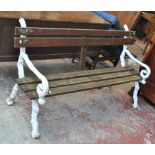 A 20th century garden bench, the cast iron ends naturalistically modelled as branches, width 167cm.