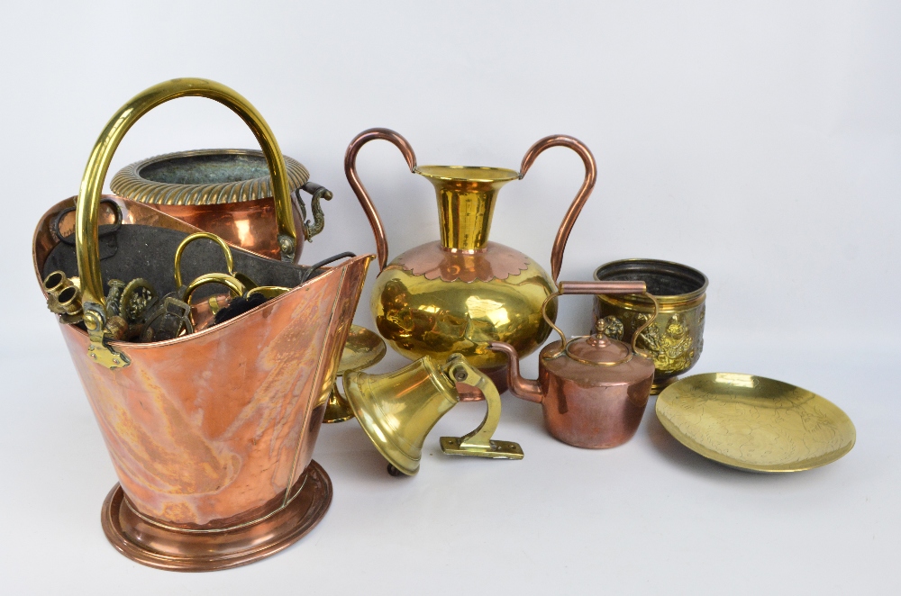 A group of metalware including a small copper kettle, a copper and brass coal bucket,