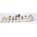 A quantity of costume dress rings including a silver ring set with heart shaped sherry coloured