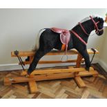 A Pegasus of Crewe children's rocking horse with black plush and white mane,