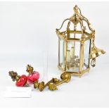 A 20th century brass hexagonal ceiling lantern with three internal lights and bevelled glass panels
