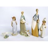 Four Lladro figures; 'Shepherdess with Basket' 4678 (boxed), 'Girl with Goose and Dog' 4866,