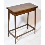 An Edwardian mahogany and inlaid rectangular foldover card table on square tapering stretchered