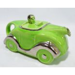 A novelty Art Deco 'Car' teapot, with green body, painted silver lustre with number plate 'OKT42',