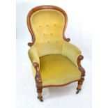 A Victorian walnut framed open armchair with button upholstered back and seat,