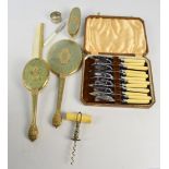 A small collectors' lot including a bone handled corkscrew, a four piece dressing table set,