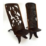 Two African carved hardwood birthing chairs.