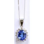 An 18ct white gold diamond and tanzanite pendant, the oval cut tanzanite weighing approx 4.