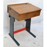 A vintage child's school desk with painted lower section,