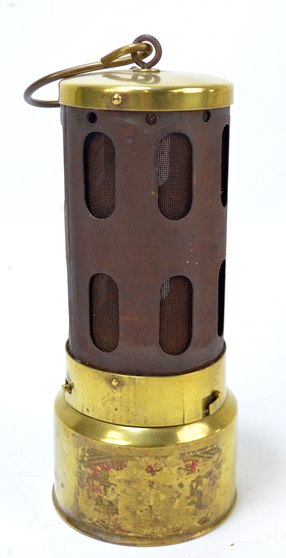 An early to mid-20th century car heater with traces of original decal decoration and indistinct