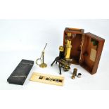 J SWIFT & SON; a late 19th century lacquered and painted brass monocular microscope, patent no.
