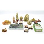 A collection of Oriental soapstone figures and figure groups,