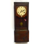 An early 20th century clocking in clock.