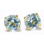 A pair of 9ct yellow gold aquamarine ear studs.