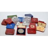 A collection of cased sterling silver coins and medals, predominantly proof and limited edition,