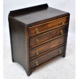 An early 20th century oak four drawer chest, width 76.5cm.