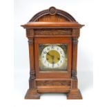 JUNGHANS; a circa 1900 German stained beech eight day chiming mantel clock,