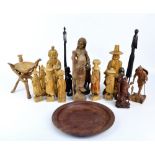 A group of various carved wooden figures including a Chinese fisherman and immortal,