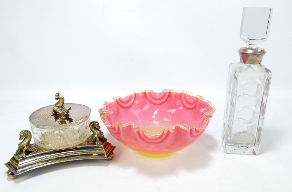 An electroplated and clear pressed glass butter dish with sea creature shaped finial and similarly