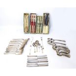 A quantity electroplated cutlery, flatware and serving tongs,