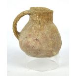 An early Bronze Age pottery single handed vessel, circa 3200-2300 BC, height 11.