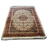 A beige ground Keshan carpet, 190 x 140cm.