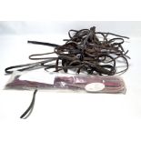 Equestrian interest; a large collection of nosebands of varying styles and sizes,