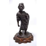 A Japanese late Meiji period bronze figure of a harvesting woman with small scythe and a sheaf of