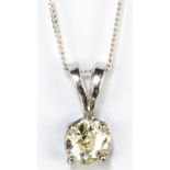 A 9ct white gold and diamond solitaire pendant, the old European cut stone weighing 0.