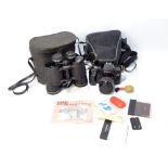 A cased Canon EOS1000F camera with accessories and a cased pair of Prinulx, 10 x 50 binoculars (2).