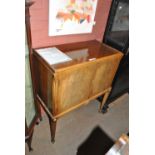 A reproduction walnut cocktail cabinet,