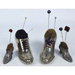 Two pairs of novelty silver plated and chromed pin cushions in the form of heeled shoes,