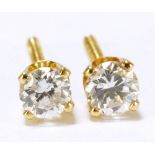 A pair of 14ct yellow gold diamond ear studs, combined diamonds weighing 0.