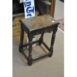 A 17th century and later carved oak joint stool inscribed 'A 1691 D' to the top, 42 x 24cm.
