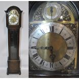 A 20th century oak long case clock with domed top above brass dial and silvered chapter ring set