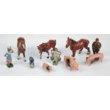 A small quantity of painted lead farmyard toys comprising three horses with one by Crescent Toys,