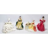 Four Royal Doulton figures; HN2220 'Winsome', HN2264 'Elegance',