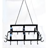 A black painted kitchen pot hanger with openwork frame set with sixteen hooks and with chain loop