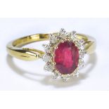 A 9ct yellow gold oval ruby and diamond floral set ring, size R, approx 2.7g.