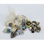 A collection of base metal thimbles, small number of buckles and a small bag of buttons.