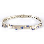 An 18ct white gold diamond and sapphire bracelet,