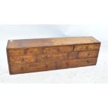 A mahogany table top cabinet assortment of eight variously sized drawers, width 85cm.