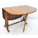 A mid Victorian burr walnut Sutherland table with rectangular top,