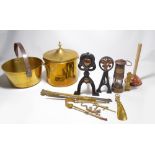 A mixed lot of metalware to include brass coal bucket, fire irons, two fire dogs, shoehorn,