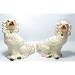 A pair of 19th century Staffordshire dogs, height 32cm.