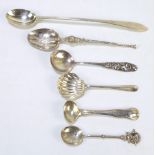 Four variously hallmarked silver spoons to include a Celtic point finial sundae spoon, TS Cuthbert,