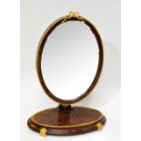 A 19th century burr walnut crossbanded and inlaid Empire style ormolu mounted toilet mirror with