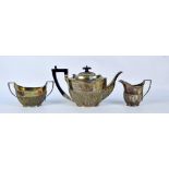 A matched hallmarked silver part gadrooned tea set,