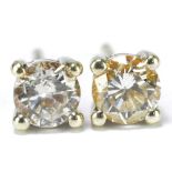 A pair of 18ct white gold ear studs each set with a brilliant cut diamond, approx 0.